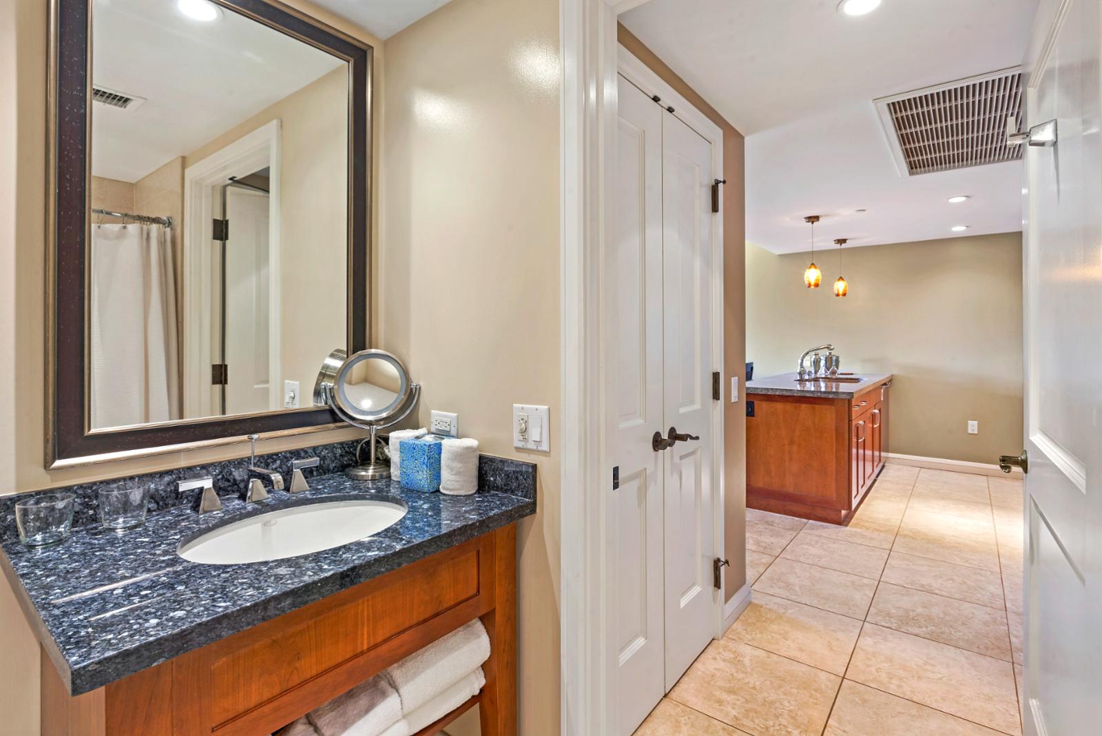 Custom marble bathroom countertops and oversized mirror