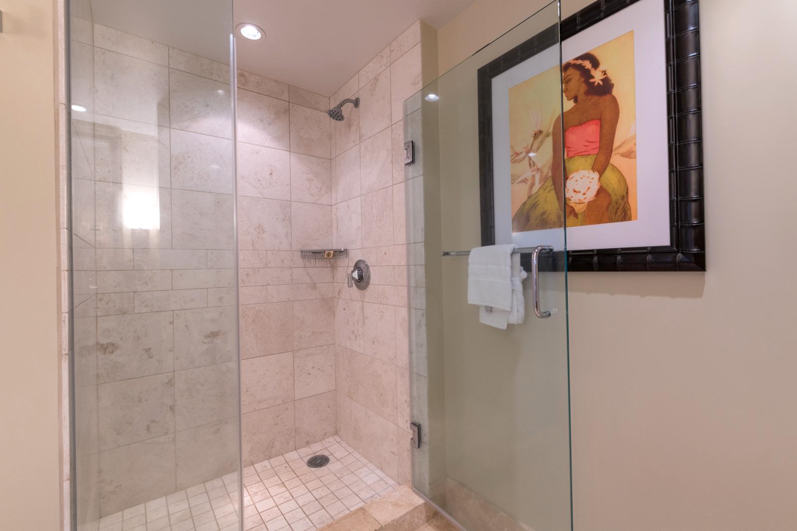 Floor to ceiling glass enclosed shower