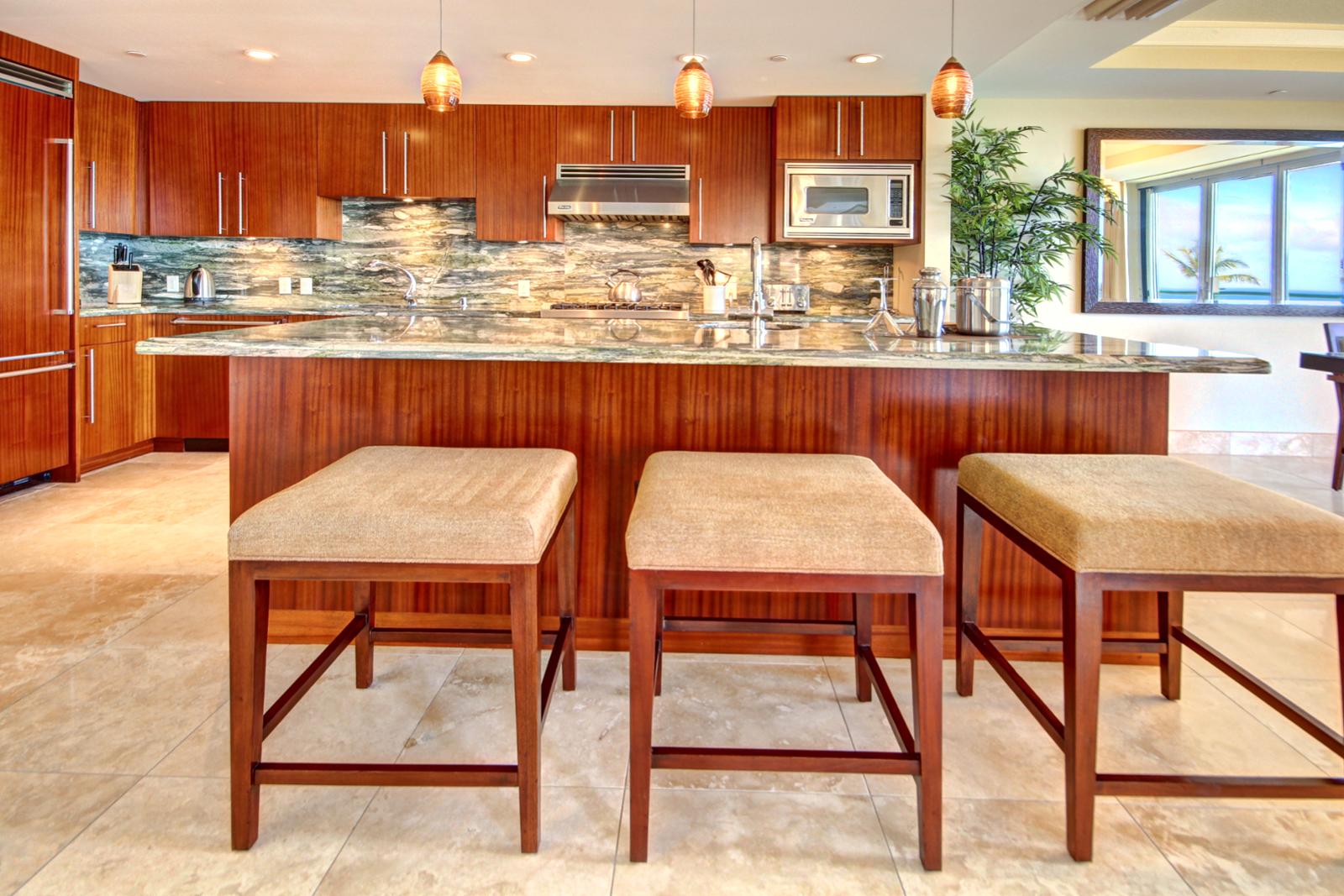 Large kitchen island with bar stools for that quick lunch or frozen libation.