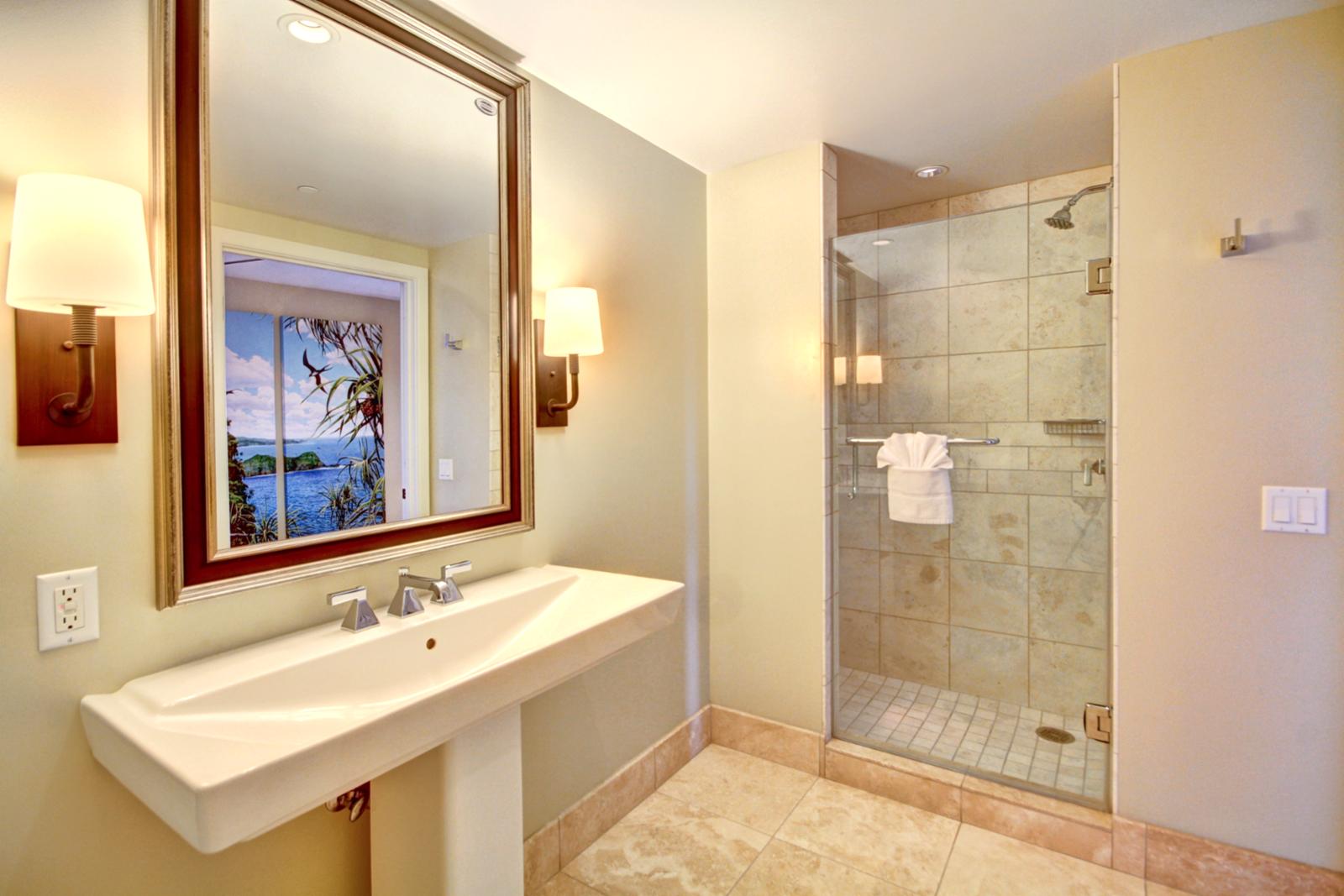 Guest bathroom with glassed in shower.