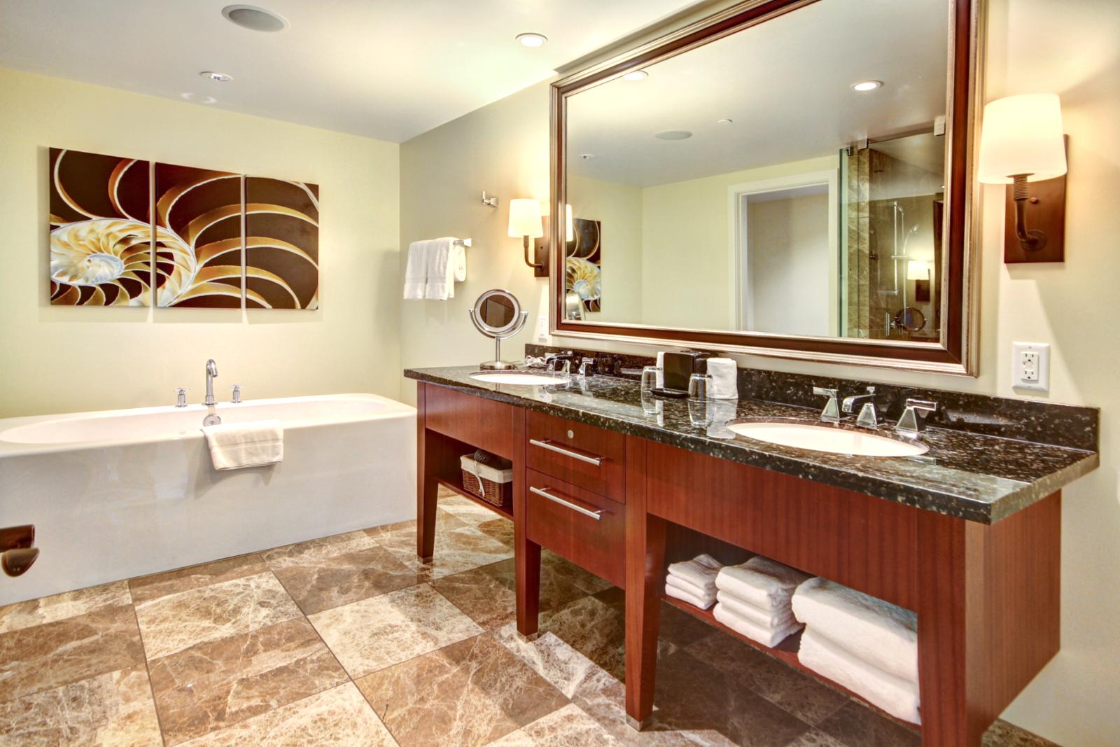 Large vanity and dual sink master bathroom with large soaking tub. 