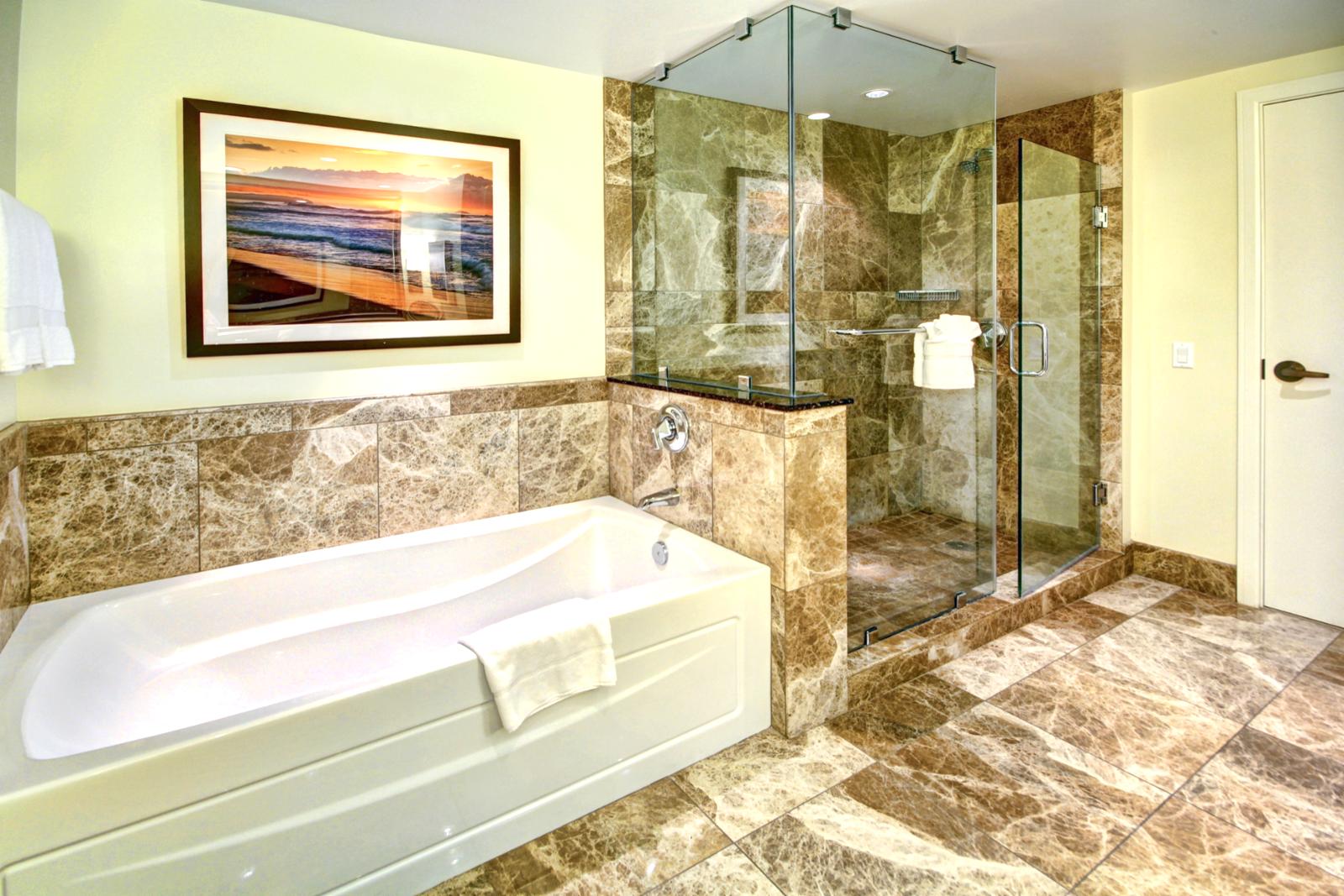 2nd master bathroom has separate shower and bathtub with custom tile throughout. 