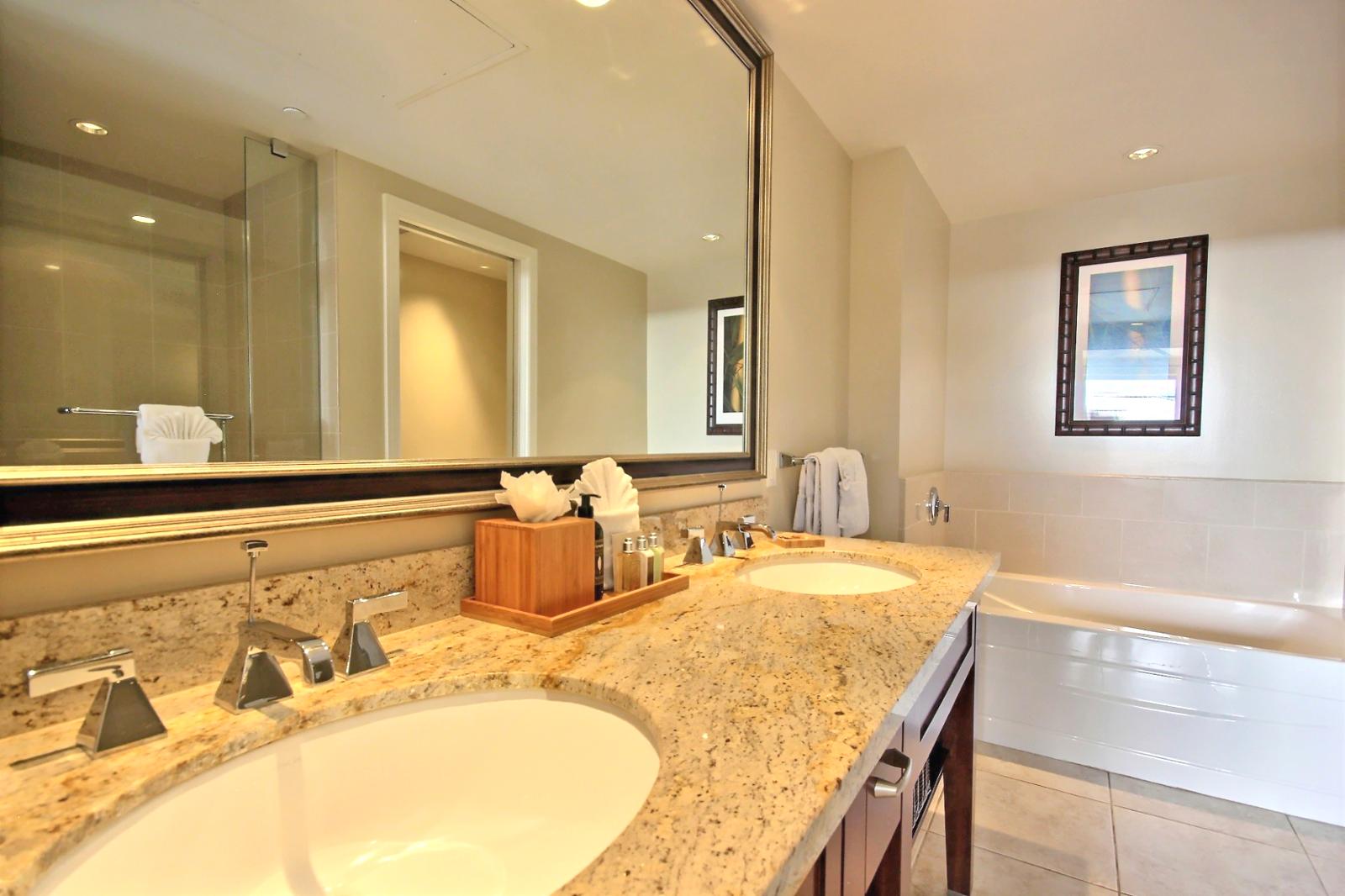 Large vanity mirror with dual sinks in the master bathroom. 