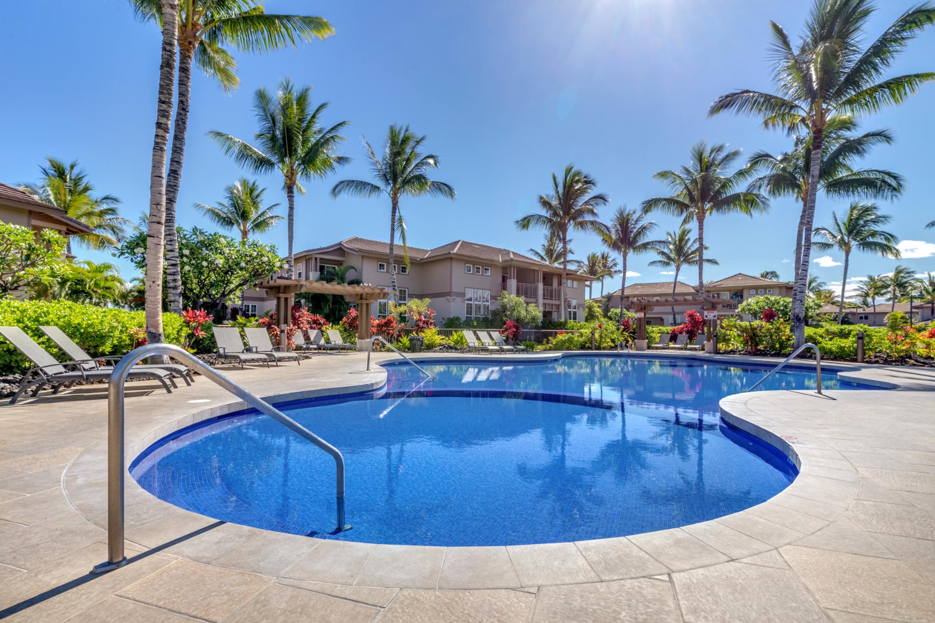 Lounge poolside with a tropical drink in hand and let the gentle breeze refresh you. The pool area here is designed for ultimate comfort.