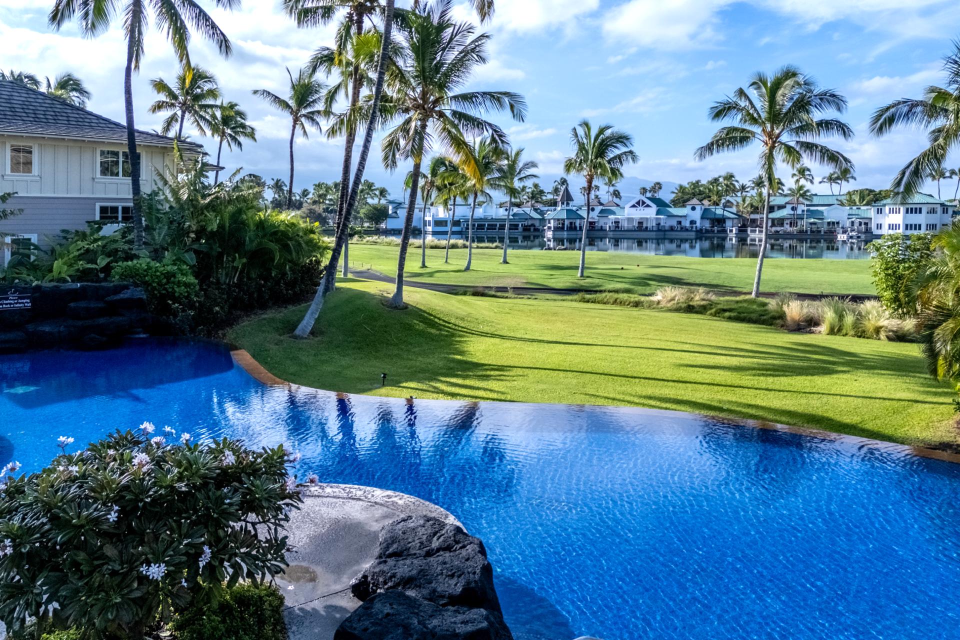 This infinity-edge pool overlooks the golf course, offering a peaceful place to float or soak in the views.