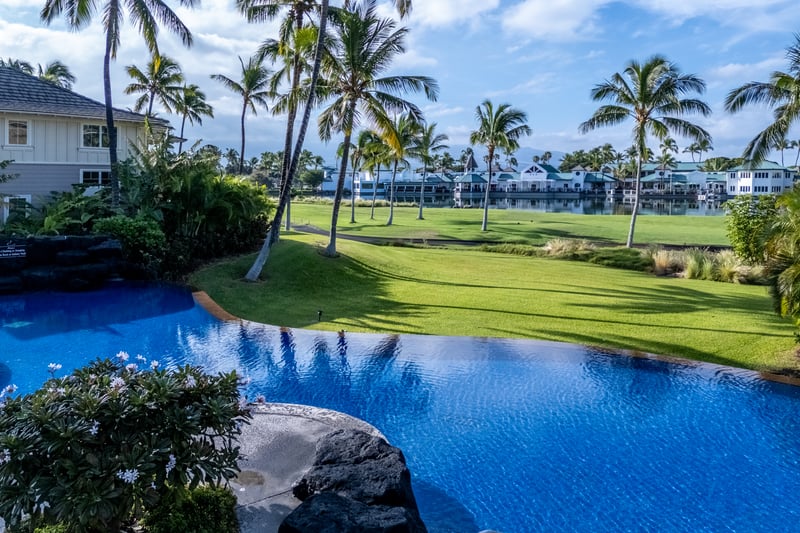 This infinity-edge pool overlooks the golf course, offering a peaceful place to float or soak in the views.