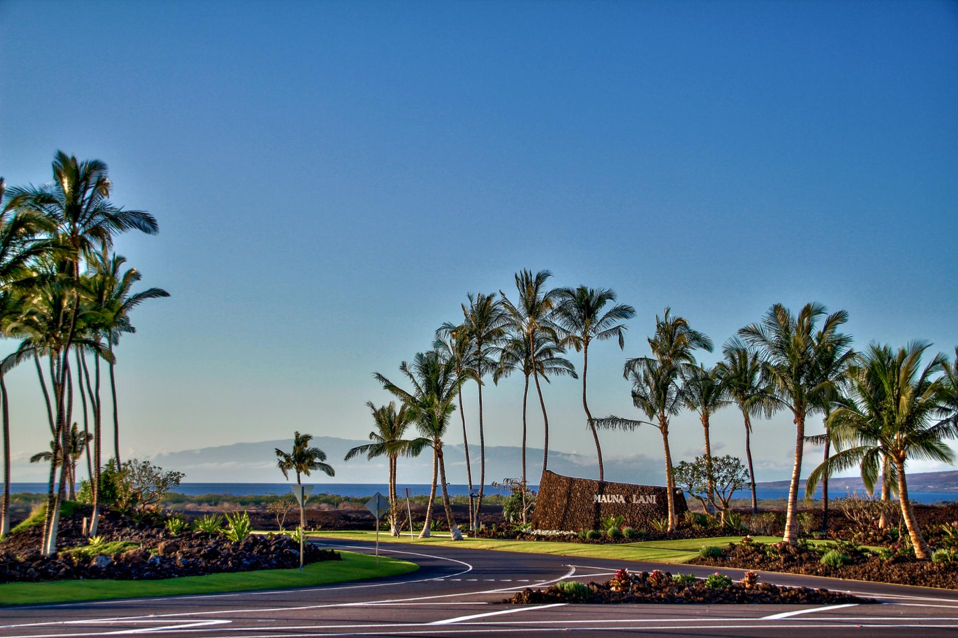 Arrive in paradise with sweeping ocean views, perfectly manicured grounds, and iconic Big Island palm-lined roads