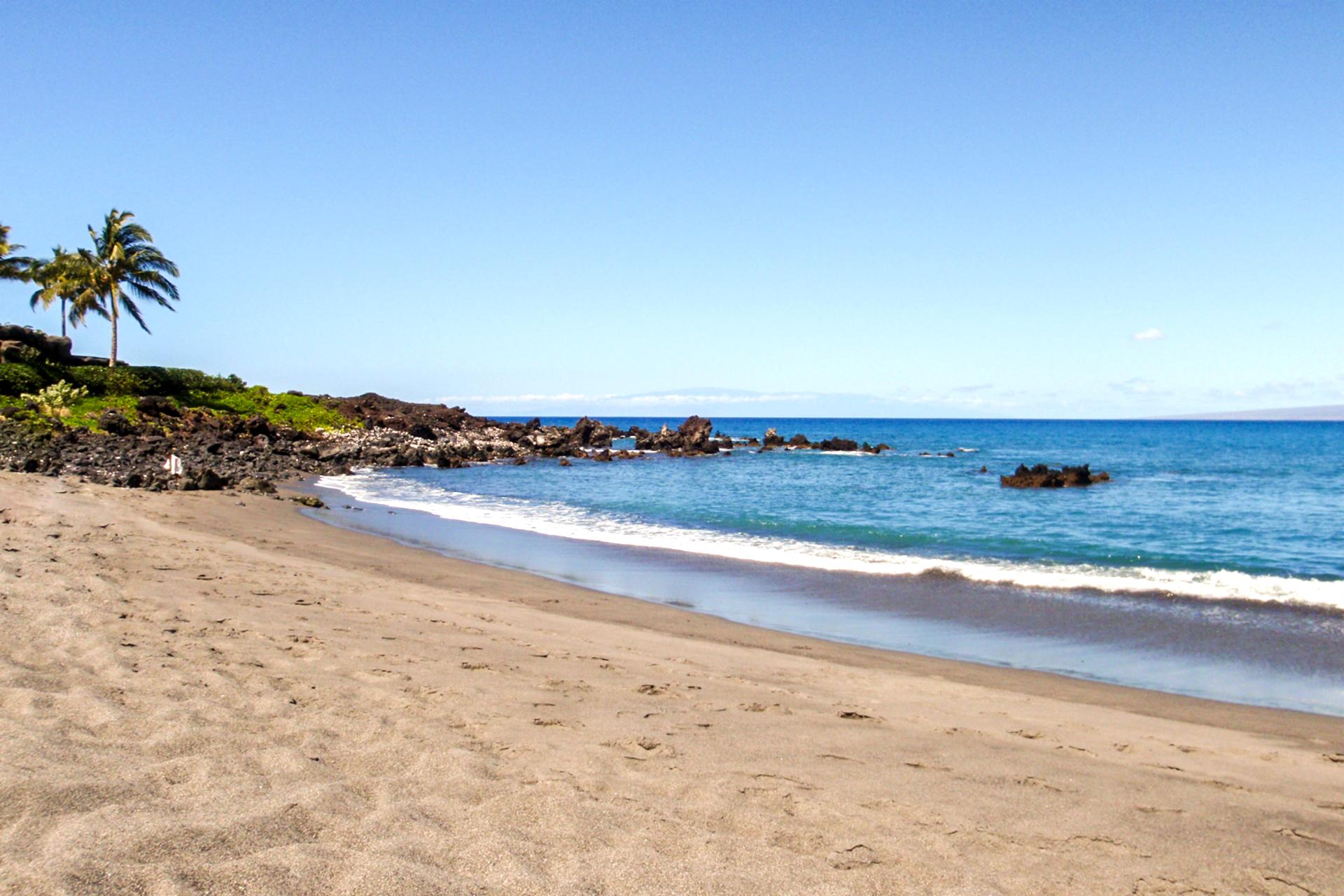 Stroll barefoot along quiet sandy beaches with crystal-clear waters, swaying palms, and peaceful ocean views