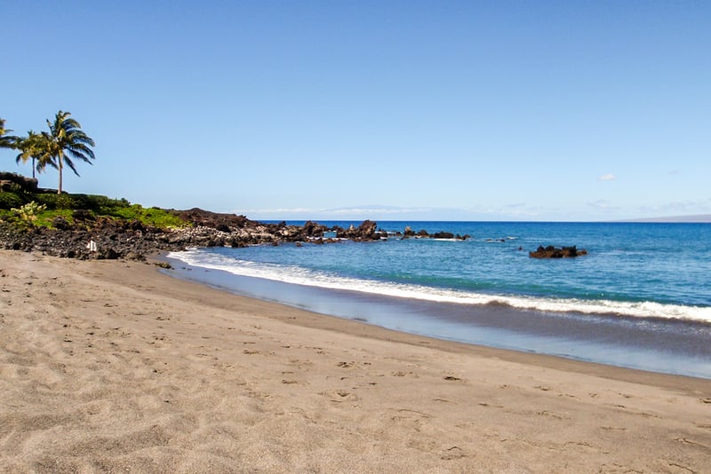 Stroll barefoot along quiet sandy beaches with crystal-clear waters, swaying palms, and peaceful ocean views