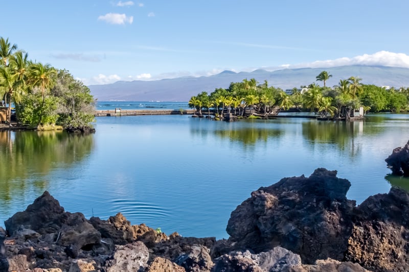 Lava rock-lined lagoons offer crystal waters, tropical foliage, and panoramic island views for pure relaxation