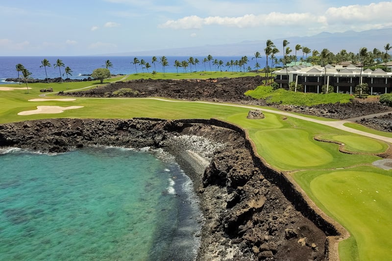 Tee off on world-class oceanfront golf courses with dramatic lava cliffs and breathtaking panoramic sea views