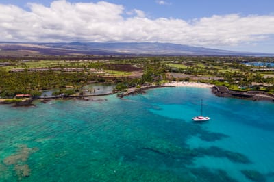 Enjoy one of the Big Island's most gorgeous beaches by boat