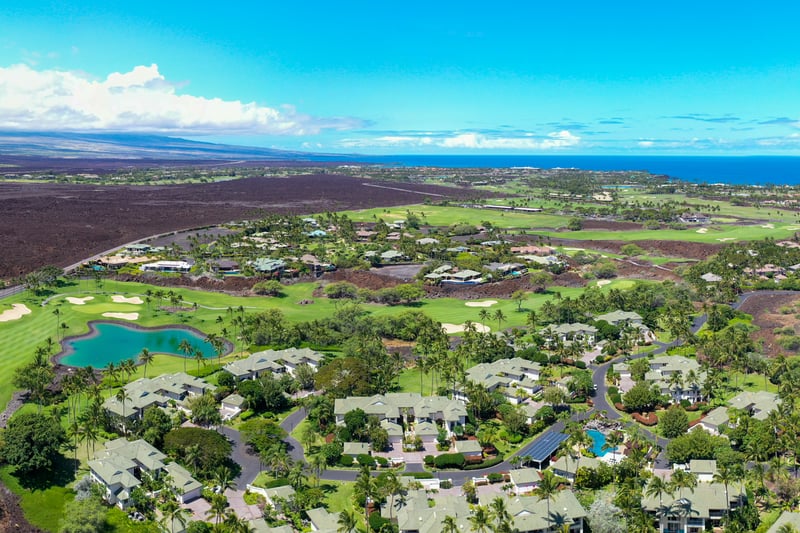 The lush golf course is nestled amongst the homes