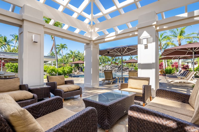 Maui resort lounge, outdoor pergola seating, tropical vacation rental, luxury resort amenities, shaded outdoor relaxation