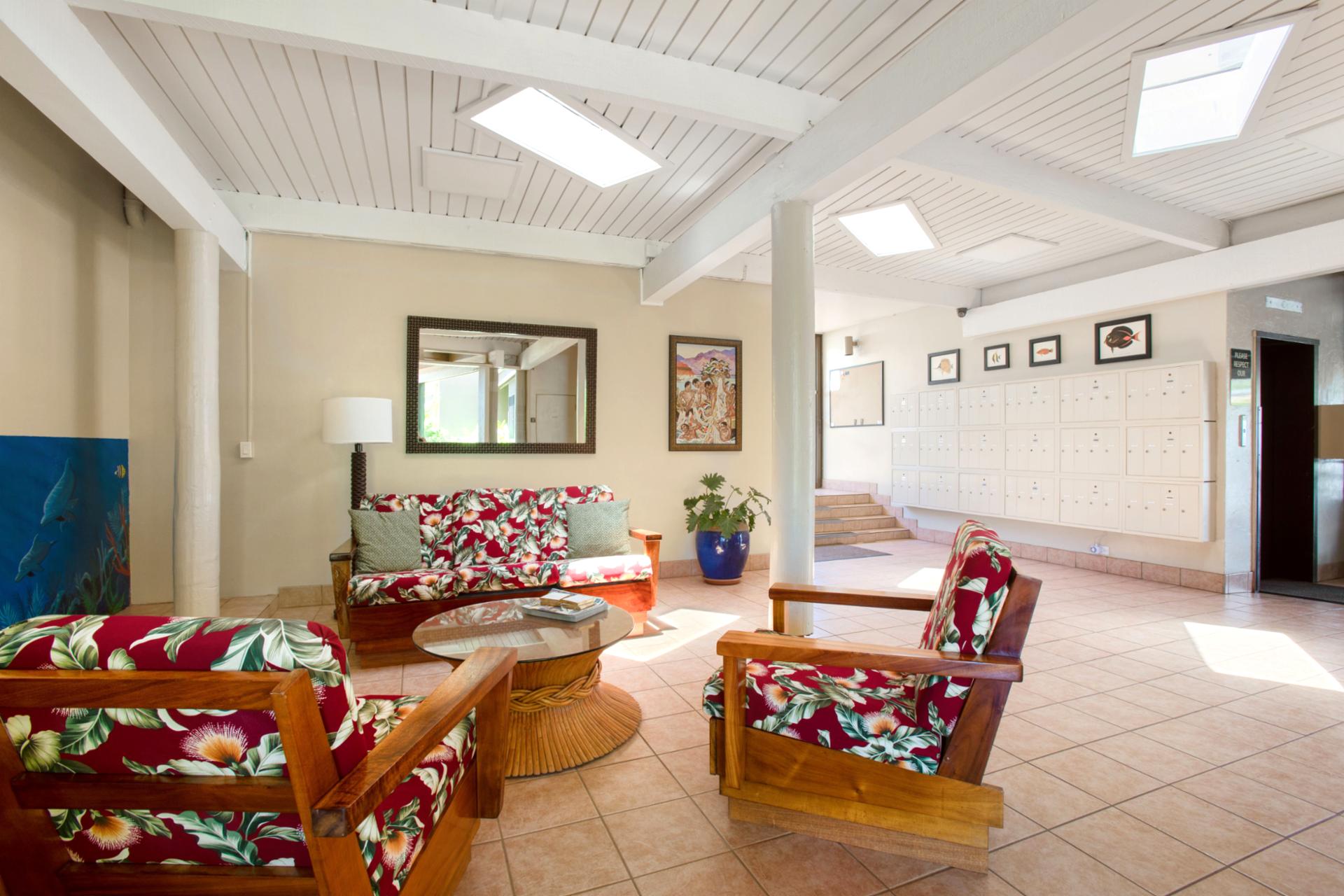 Welcome to Hale Ono Loa: bright open-air lobby with island décor, natural light, seating & warm Maui hospitality