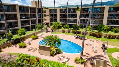 Relax at Hale Ono Loa’s oceanfront pool surrounded by swaying palms, tropical gardens & breathtaking Pacific views