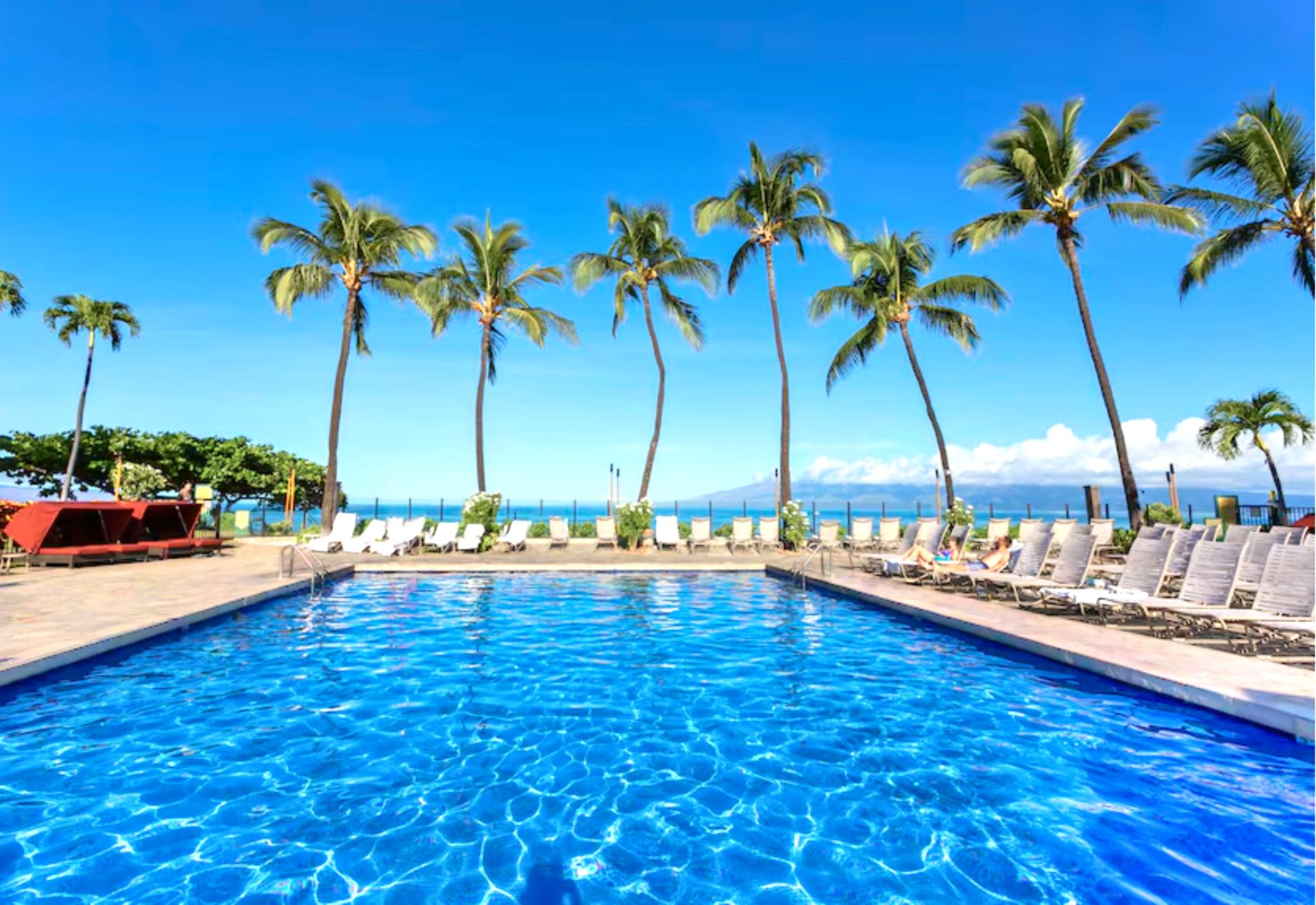 Soak in panoramic ocean views at Kaanapali Shores, where the beachfront pool deck offers luxury sunbathing steps from the sea