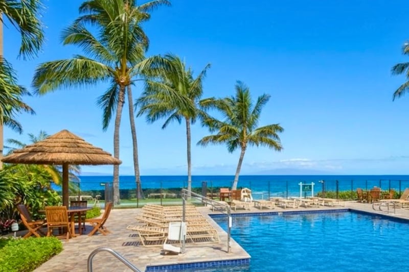 Enjoy the ocean views and swaying palm trees while cooling off in the pool.