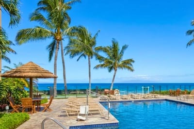 Enjoy the ocean views and swaying palm trees while cooling off in the pool.