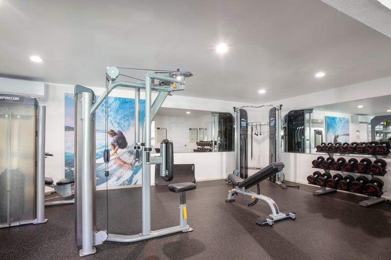 Resort gym offering state-of-the-art equipment, free weights & open-air inspired workout space for guests