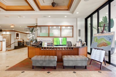 Resort front desk with bright open spaces, sophisticated design & personalized service to welcome every guest