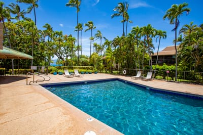 The sparkling pool lights up the night at Maui Sands, inviting evening swims under the stars. Experience island magic any time of day.