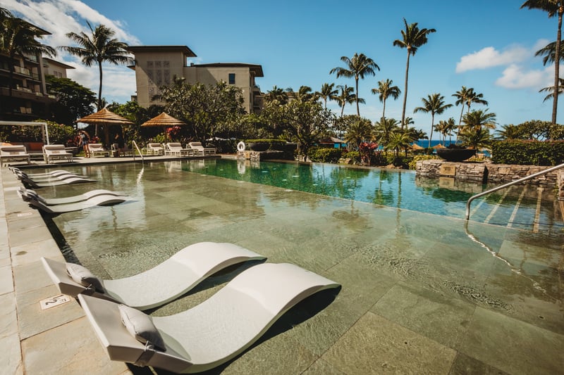 Bask under Maui’s sun on in-water loungers, steps from palm-lined pools, luxury amenities & ocean breezes
