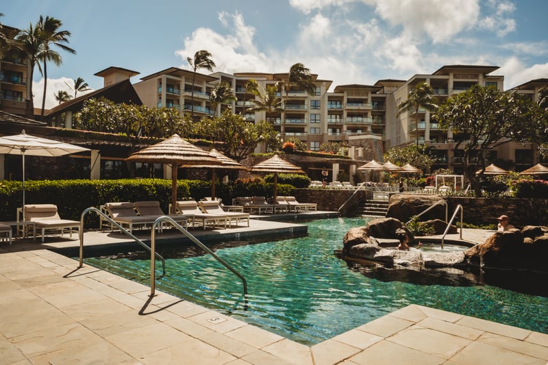 Relax in our crystal-clear oceanfront pool surrounded by lush gardens, luxury cabanas & stunning Maui views