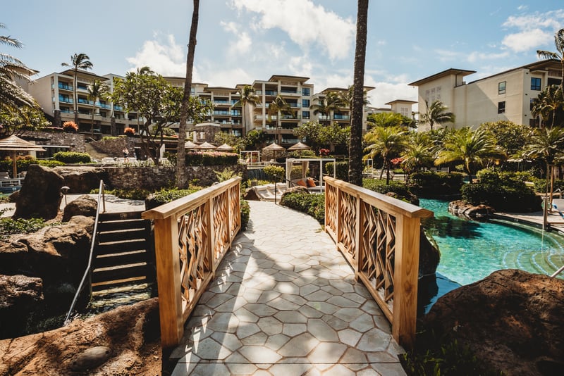 Stroll the resort’s scenic bridges, lush tropical gardens & lagoon-style pools for perfect island serenity