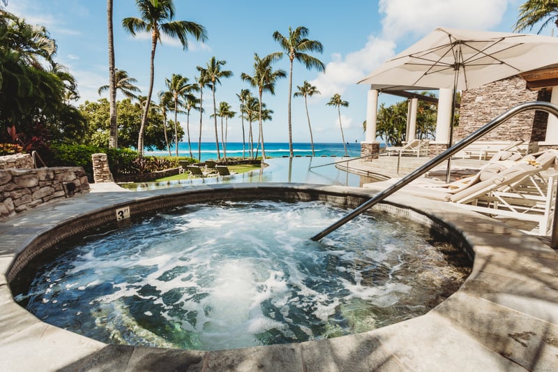 Soak in our oceanview hot tub surrounded by tropical palms, serene views & ultimate resort relaxation