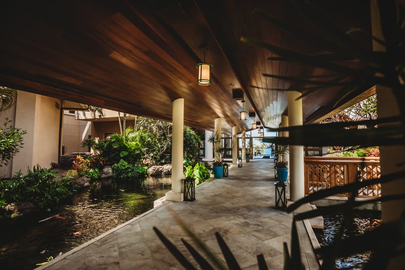 Enjoy shaded walkways surrounded by flowing ponds, exotic greenery & the soothing sounds of island serenity