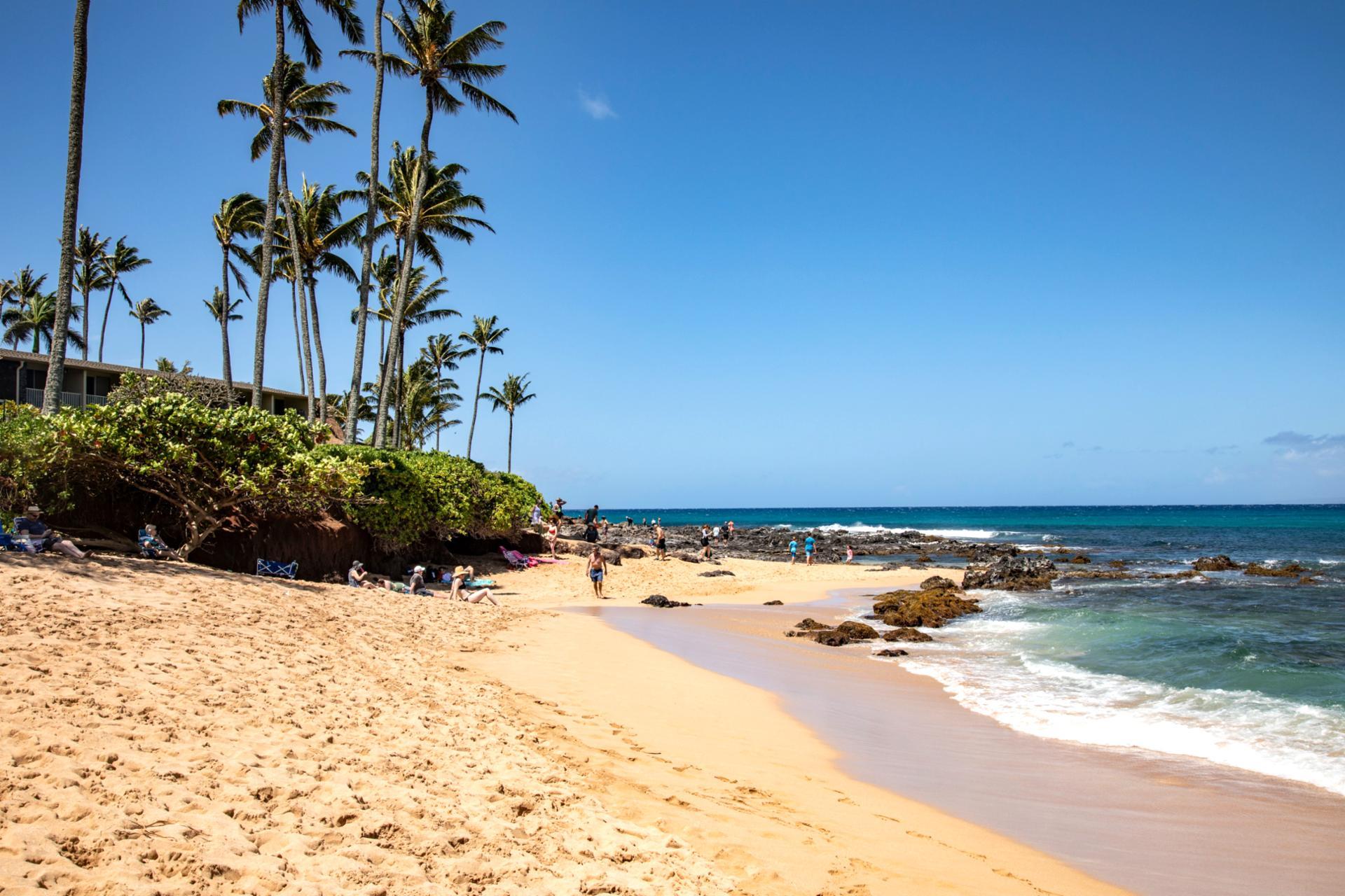 Discover Napili Bay’s tranquil beauty — soft golden sands, turquoise waters & luxury beachfront relaxation in Maui