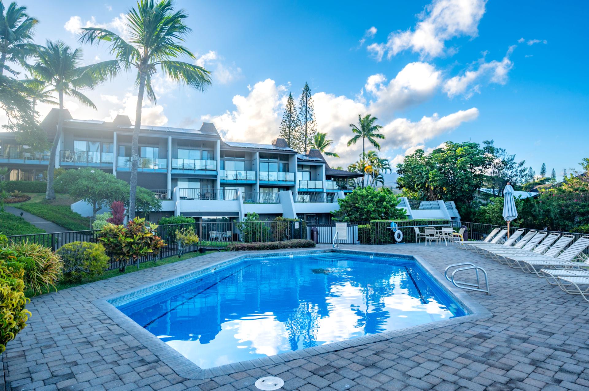 Tropical greenery surrounds this Napili Point pool, set just below private lanais for a quiet, easy-access swim anytime of day.