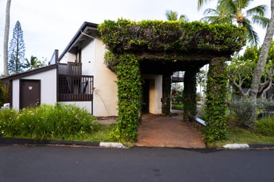 The lush entry of Napili Point Resort sets the tone for your Maui getaway, inviting you into a world of tropical elegance and island charm.