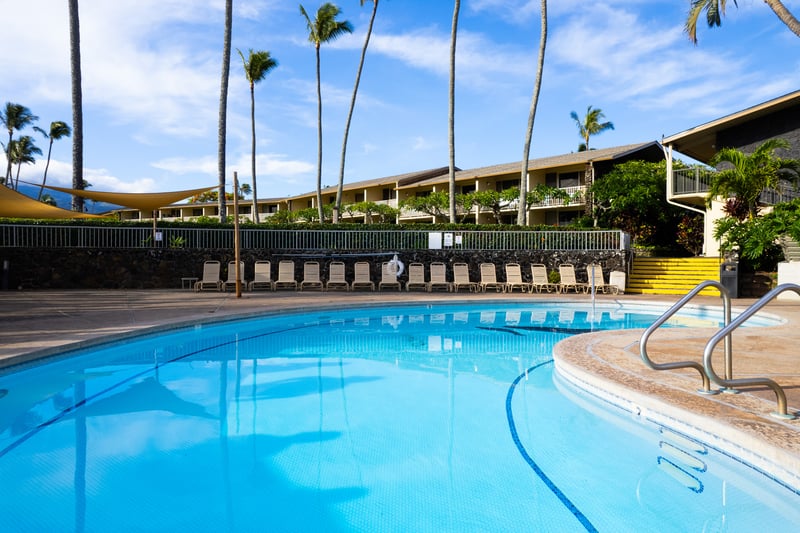 Swim, lounge & relax in crystal-clear pools surrounded by tropical gardens at Napili Shores Resort