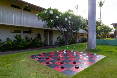 Island recreation includes shuffleboard, oversized checkers & lush surroundings at Napili Shores