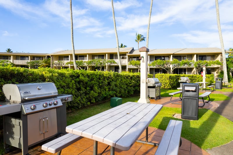 Outdoor BBQ grills with picnic seating create the perfect island dining experience at Napili Shores