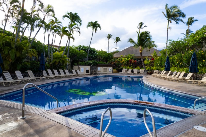 Relax in sun-soaked pools with ocean views, lush gardens & tranquil island vibes at Napili Shores