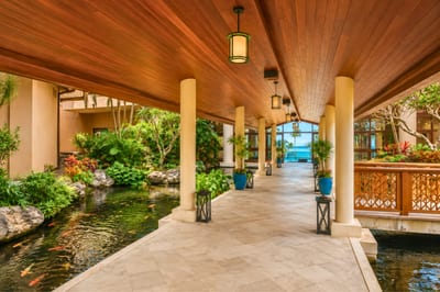 Enjoy shaded walkways surrounded by flowing ponds, exotic greenery & the soothing sounds of island serenity