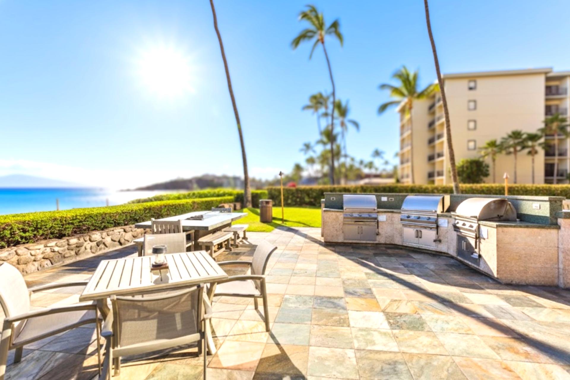 Beachfront BBQ pavilion with panoramic ocean views, outdoor dining, tropical landscaping, seating & relaxed island atmosphere