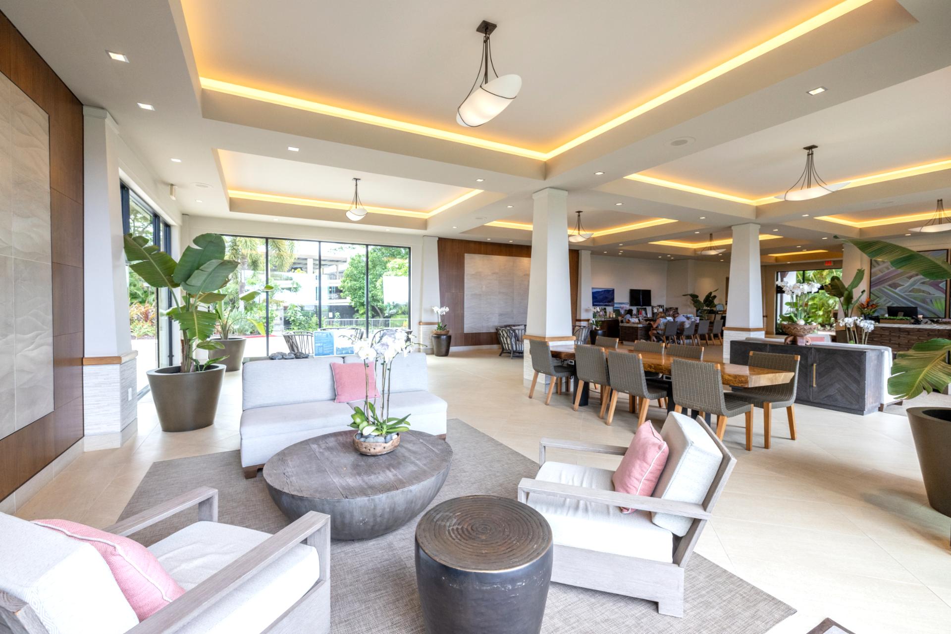 Sophisticated resort lobby blending indoor-outdoor living, tropical greenery, modern décor, and oceanfront resort luxury.