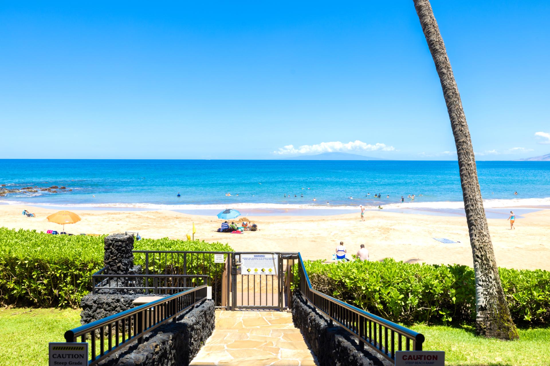 Private gated access opens directly to soft white sands & crystal-clear waters for exclusive beach serenity