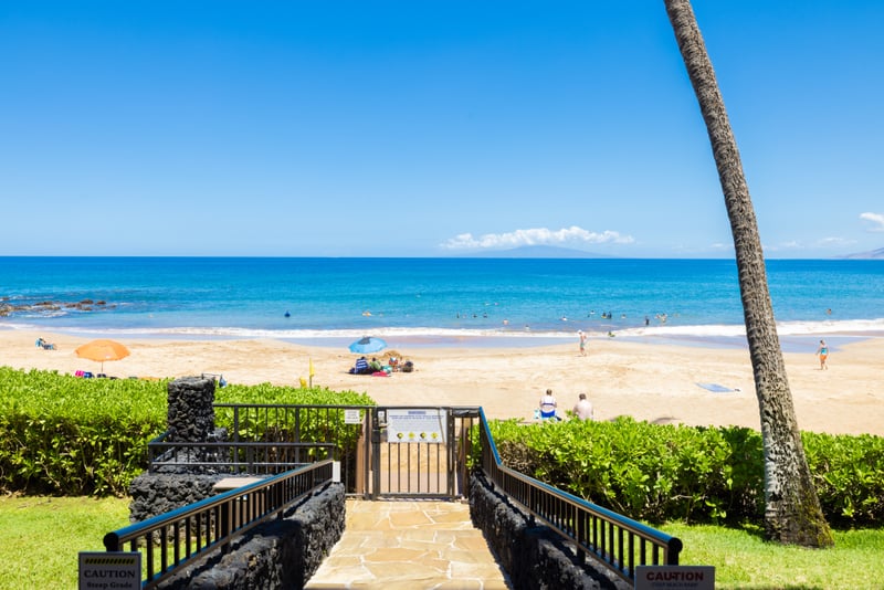 Private gated access opens directly to soft white sands & crystal-clear waters for exclusive beach serenity