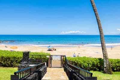 Private gated access opens directly to soft white sands & crystal-clear waters for exclusive beach serenity