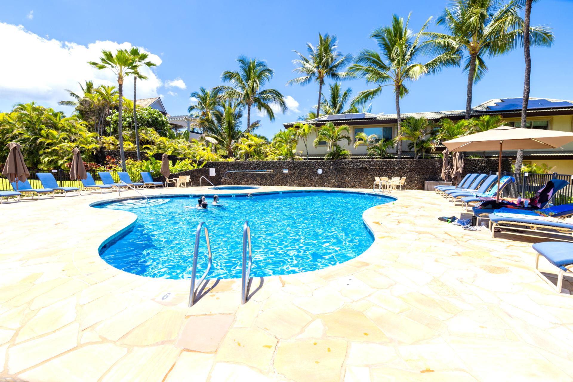 Oceanfront pool deck with luxury loungers, lush gardens & direct access to pristine white sand beaches