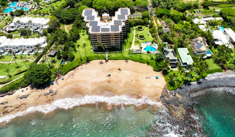 Luxury beachfront escape with ocean views, private beach access, resort pool, tropical gardens & solar power