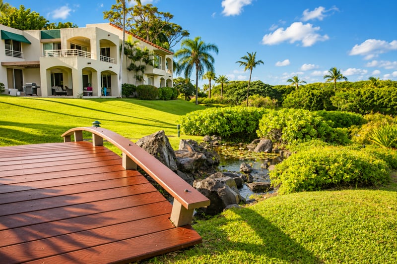 Scenic walking paths wind through beautifully maintained gardens, creating a peaceful resort atmosphere.