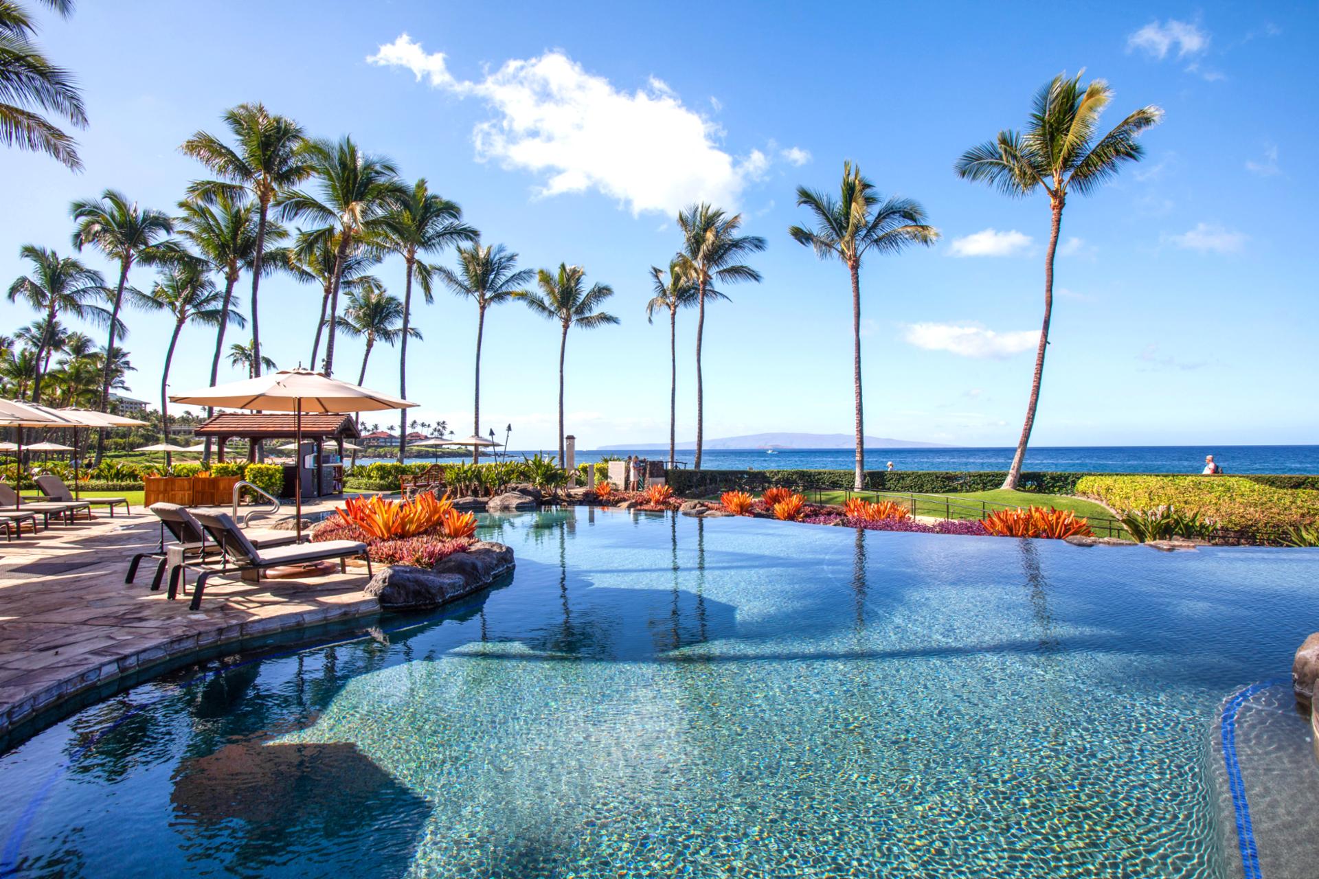 Relax poolside at Wailea Beach Villas, where Maui luxury, infinite views, and tropical elegance unite