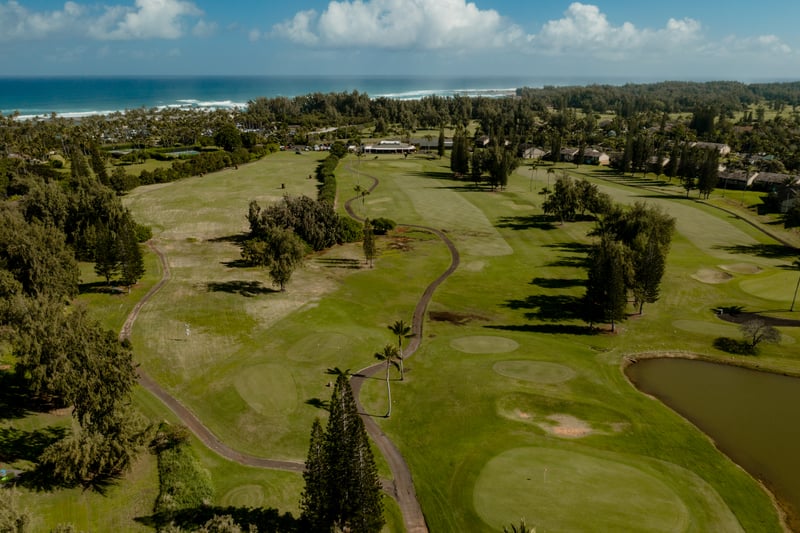 Rolling fairways at Kuilima Estates offer ocean-view golf with tropical trees, serene ponds, and a peaceful North Shore setting perfect for every level of play.