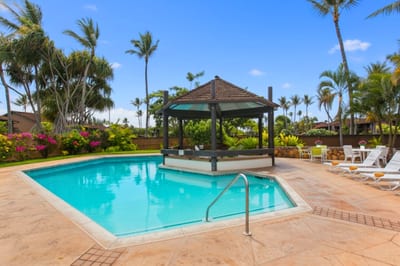 Luxury vacation getaway: relax poolside with ocean breeze, tennis, golf, lush gardens & tropical serenity